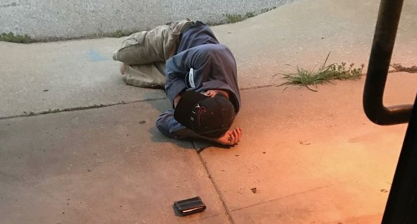 Homeless man wishing to find his lost dog sleeps outside of the shelter