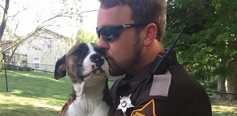 Unwanted dog abandoned by her owners in a park was adopted by the policeman who saved her