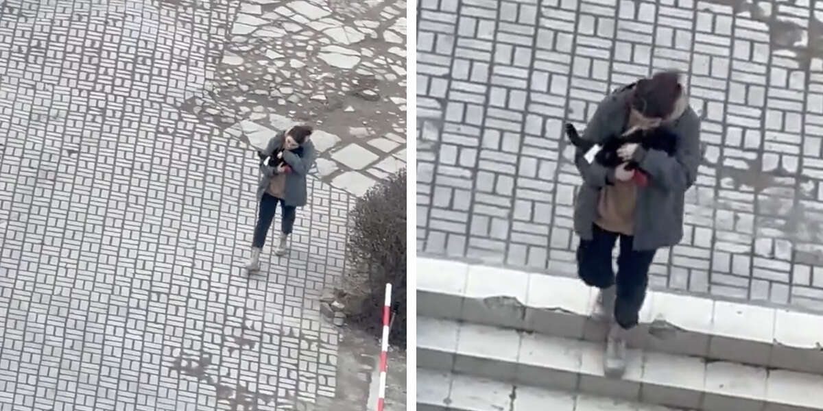 Woman In Ukraine Seen Comforting A Cat While Air Raid Sirens Sound